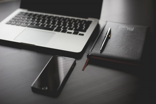 desk with notebook, laptop and smartphone, project management, liquid planner
